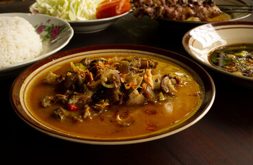 Tongseng Kambing, is a spicy curry made from goat meat, in shallow focus.