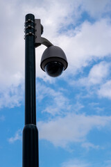 Security cam in front of blue sky