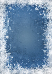 Snow background. Blue Christmas snowfall with defocused flakes and swirls. Winter concept with falling snow. Holiday texture and white snowflakes
