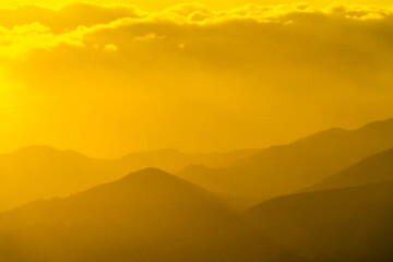 Yellow Sunset with Hills, Mountains, silhouette