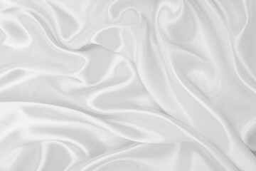 Obraz premium Smooth elegant white silk or satin luxury cloth texture as wedding background. Luxurious background design