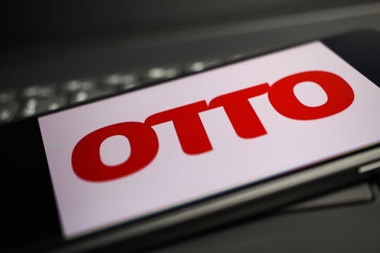 Viersen, Germany - May 9. 2020: Close up of mobile phone with german otto online trader logo lettering on computer keyboard