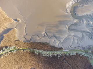 aerial drone photo of tresillian river in cornwall England uk. mud and reeds 