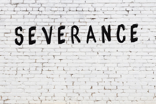 White wall with black paint inscription severance on it