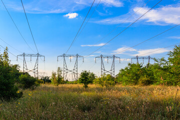 High voltage power line against blue sky