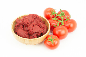 Traditional turkish tomato paste in bowl or spoon with fresh tomatoes isolated on white background