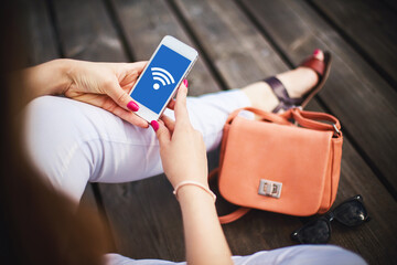 Home Wifi network. Wireless internet connection. Tablet mobile spot. Online symbol background. Wi-fi icon. Modern computer technology. Mobile device network signal. Girl holding mobile phone.