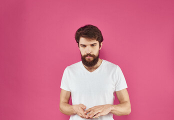 Portrait of a man t-shirt on a pink background cropped view