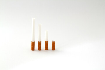 Nicotine addiction, a lot of cigarettes on a white isolated background