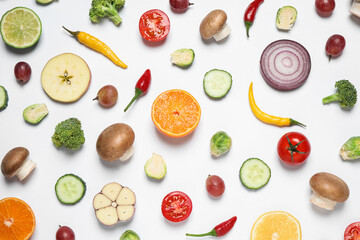 Obraz na płótnie Canvas Fresh organic fruits and vegetables on white background, flat lay