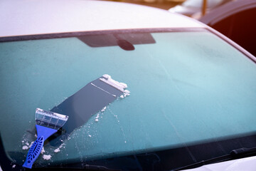 Cleaning with frozen windshield and ice scraper - obrazy, fototapety, plakaty