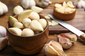 Fresh organic garlic on wooden table, closeup