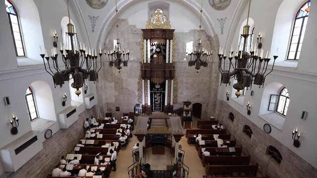 Inside the synagogue in the Old City of Jerusalem. Jewish quarter. Jews are praying.