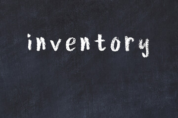 Black chalkboard with inscription inventory on in