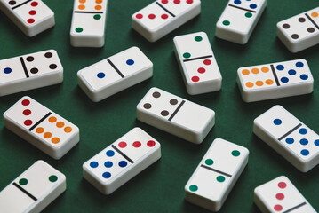 Domino tiles on green table