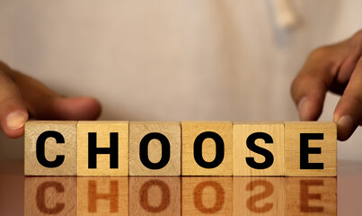 choose words from wooden blocks with letters, top view gray background