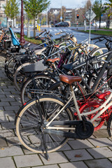 Fototapeta na wymiar City life and transportation in Netherlands, bicycle parking in old part of Amsterdan