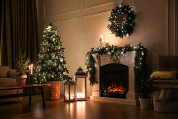 Beautiful room interior with fireplace and Christmas decor in evening