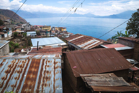 Local houses with rusty tin roofs in mountain village along lake Atitlan, Santa Cruz la Laguna, Guatemala