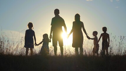 Happy large family at sunset.
