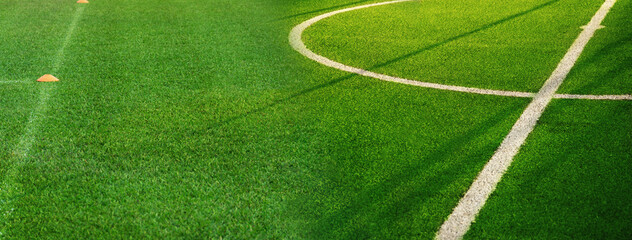 green grass of football field with white curve line sport competition banner background