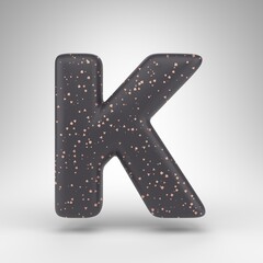 Letter K uppercase on white background. Black matte 3D rendered font with copper dots texture.