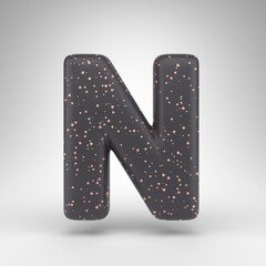 Letter N uppercase on white background. Black matte 3D rendered font with copper dots texture.