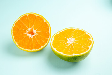 front view fresh tangerine slices on light-blue background fruit orange photo color citrus grapefruit