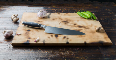 Butcher knife in stainless steel with a wooden handle, which facilitates the grip and prevents it...