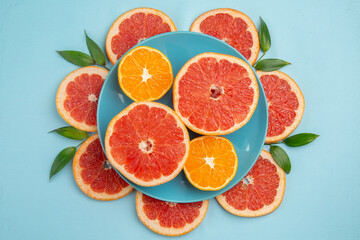 top view tasty grapefruits fruit slices on blue background fresh citrus fruits juice mellow color