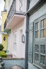 Row of colorful British houses with balconies and plants