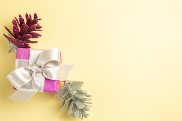 top view little christmas present on light-yellow background new year xmas color holiday photo gift free place
