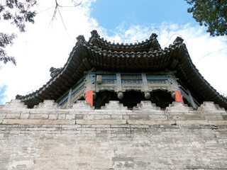 Looking up at the ancient Chinese city tower