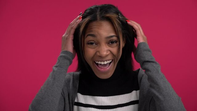 Attractive young African-American woman screams Oh My God slow motion