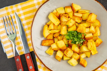 top view tasty fried potatoes inside plate on a dark-grey background color photo cuisine meal food
