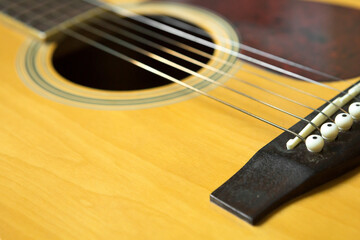 Obraz premium Selective focus of Bridge on Acoustic guitar and copy space