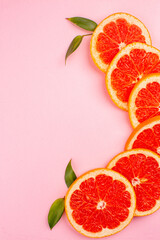 top view tasty grapefruits juicy fruit slices on a pink background fresh mellow fruit color diet citrus juice