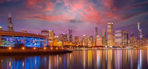 Fototapeta na wymiar Chicago Skyline Cityscape at night with lake in front and blue sky with cloud, Chicago, United state