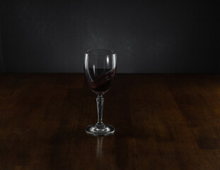 A glass of wine swirling in a wine glass.