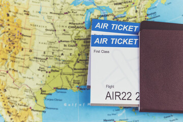 Air Ticket and passports on the map, flight to america, travel concept