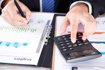 Accountant using a calculator for accounting