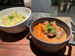 Boeuf Bourguignon, beef stew with red wine, mushrooms, bacon, truffle mash potato served in a cocotte
