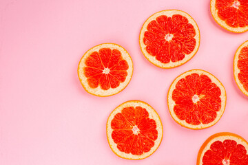 top view tasty grapefruits sliced juicy fruits lined on the pink background juice fresh fruit color citrus diet