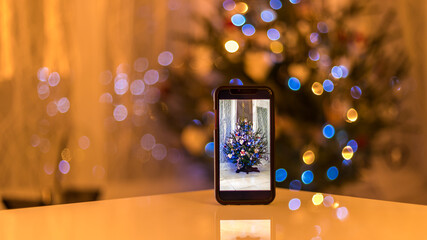 Christmas tree thru a smartphone with a beautiful bokeh in background