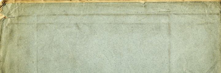 Fototapeta premium Paper texture. Old book cover. Rough faded surface. Blank retro page. Empty place for text. Panoramic background for vintage style design.
