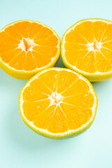 front view fresh tangerine slices on light-blue desk photo color orange citrus fruit