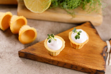 Canapes with light cream filling. Still life with microgreens. The concept of an appetizing snack.