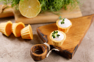 Canapes with light cream filling. Still life with microgreens. The concept of an appetizing snack.