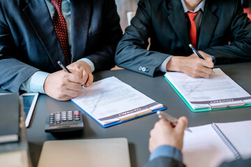 Businessman sign the contract, the agreement in the document.