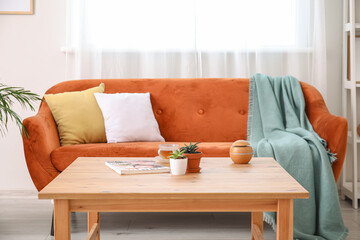 Stylish interior of modern living room with table
